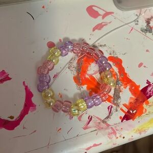 Pink yellow and purple glittery plastic bead Kandi bracelet